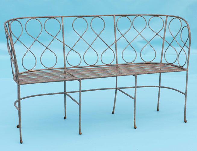 Bench with swirly detail on back and slatted seat base