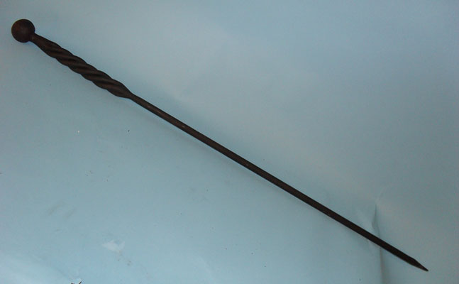 Long, heavy poker with hand forged twisted handle and ball top