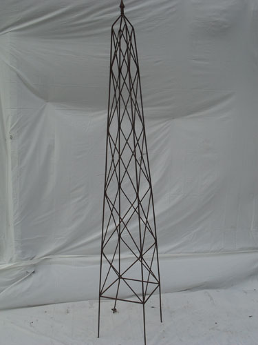 Tall obelisk with cast finial