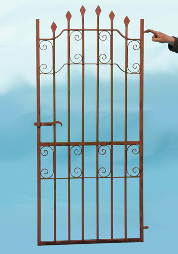 Gate with hand forged scrolls and spears