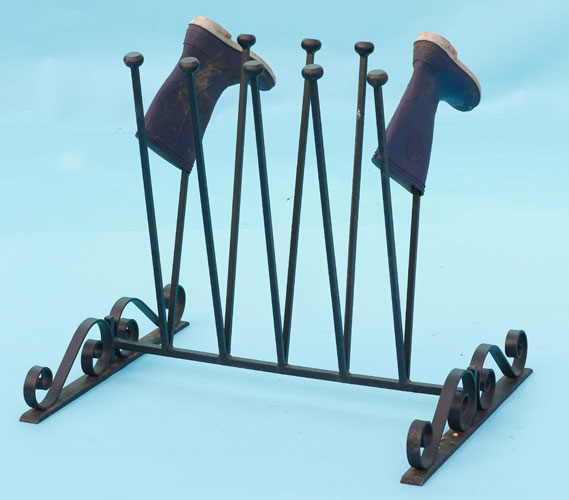 Fancy boot stand with hand forged scrolls