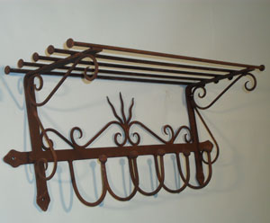 Hat and coat rack - eye catching wall hanging rack with plenty of forge work.