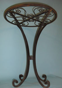 Small round table with scrolled top and feet