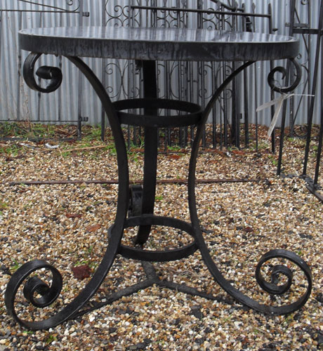 Very heavy duty round table with hand forged legs