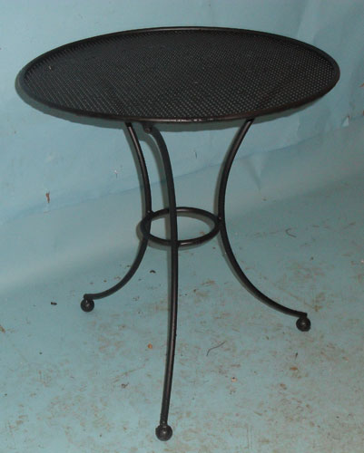 Small round table with perforated top
