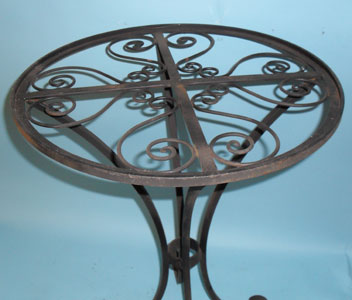 Small round table with scrolled top and feet